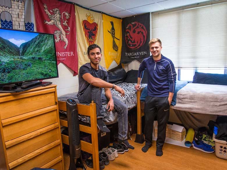 Two Penn State Behrend students show their residence hall room.