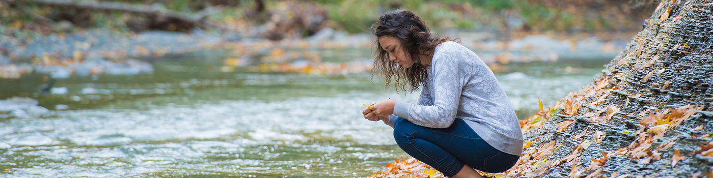 A student gathers research materials at Wintergreen Gorge, Penn State Behrend's "natural laboratory."
